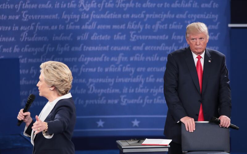 Hillary Clinton (L) and Donald Trump  during the town hall debate at Washington University on October 9, 2016 in St Louis, Missouri.