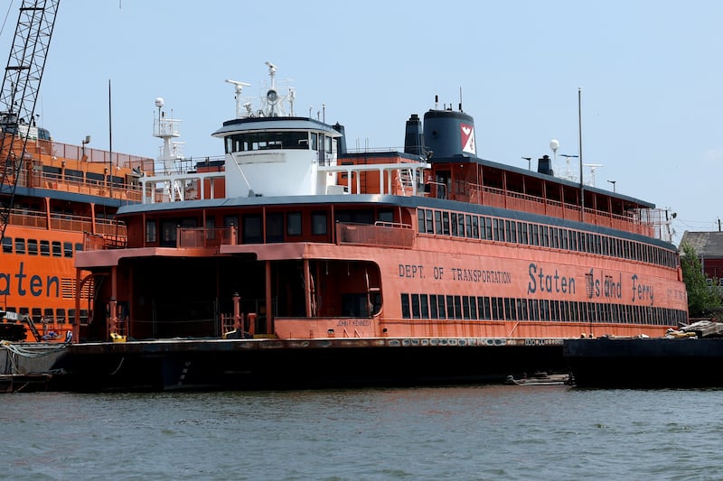 A picture of the orange and blue Staten Island Ferry owned by Colin Jost and Pete Davidson.