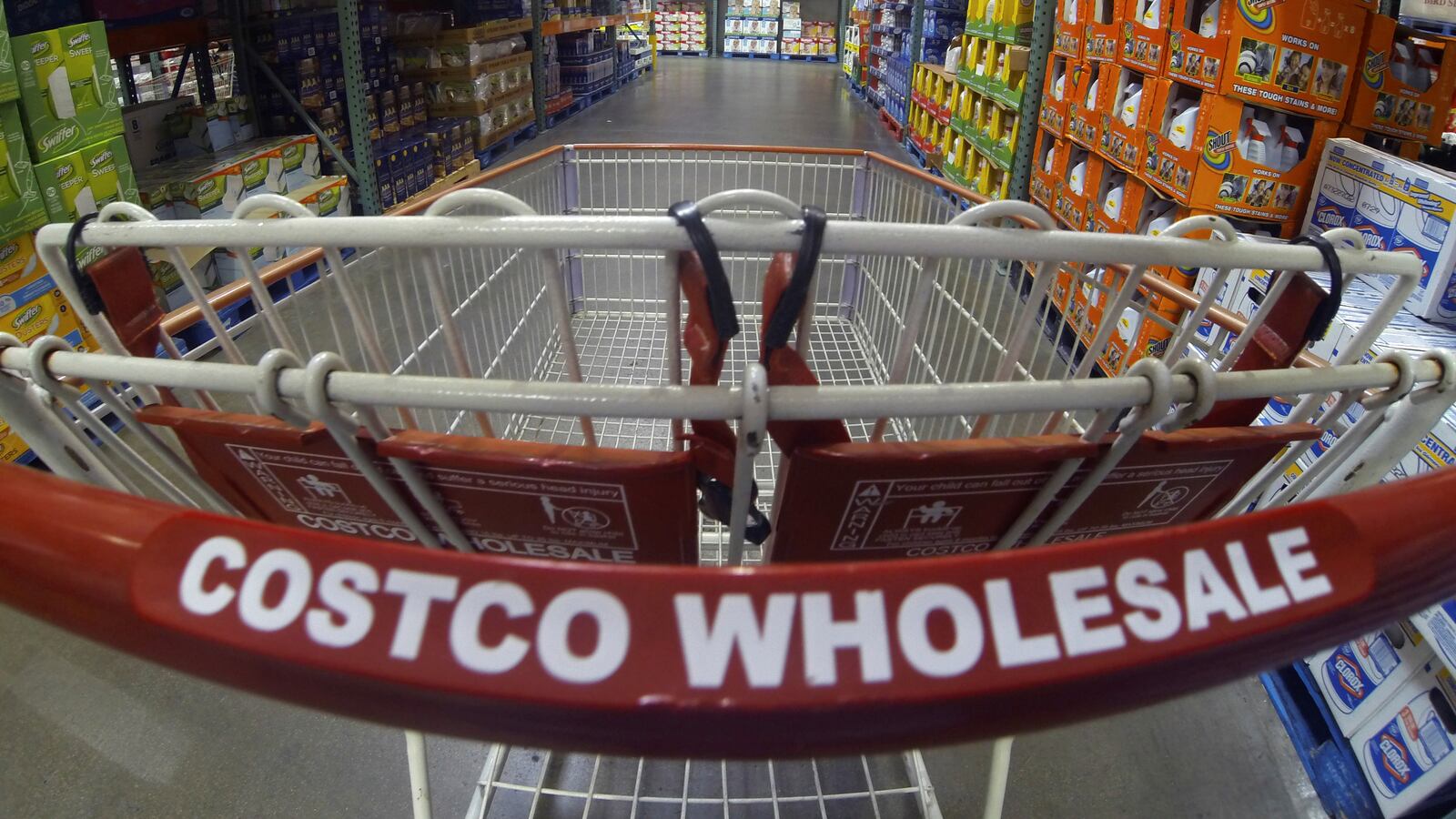 A Costco shopping cart is shown at a Costco Wholesale store.