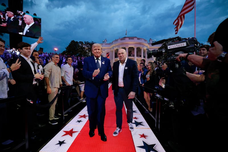 U.S. President Donald Trump arrives with UFC CEO Dana White for UFC Freedom 250 on the South Lawn of the White House in Washington, D.C., U.S., June 14, 2026. REUTERS/ Evan Vucci