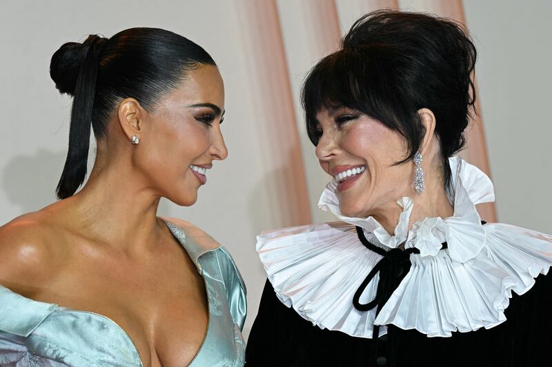 US reality TV personality Kim Kardashian and mother Kris Jenner pose during a photocall for the premiere of "All's Fair" TV series in Paris