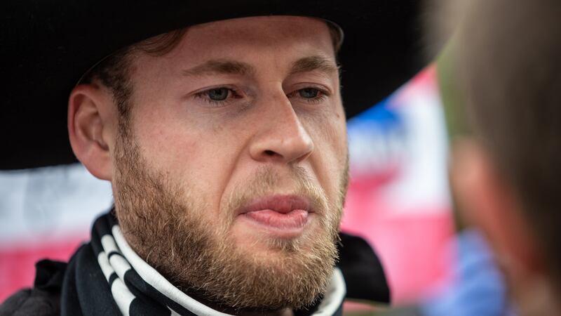 AUSTIN, TX - APRIL 18: Infowars host Owen Shroyer arrives at the Texas State Capital building on April 18, 2020 in Austin, Texas. Shroyer, who called for the protest was suspended from Twitter for urging people to break health protocols. They join other protesters across the country in taking to the streets to call for the country to be opened up despite the risk of the COVID-19.