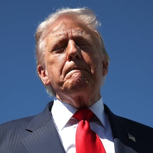 WEST PALM BEACH, FLORIDA - OCTOBER 31: US President Donald Trump speaks to reporters as he arrives at Palm Beach International Airport on October 31, 2025 in West Palm Beach, Florida. Trump is spending the weekend at his Mar-A-Lago estate in Palm Beach, Florida. (Photo by Samuel Corum/Getty Images)