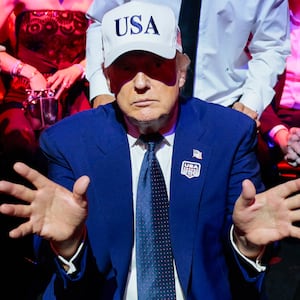 U.S. President Donald Trump gestures next to first lady Melania Trump during UFC Freedom 250 on the South Lawn of the White House on June 15, 2026 in Washington, DC.