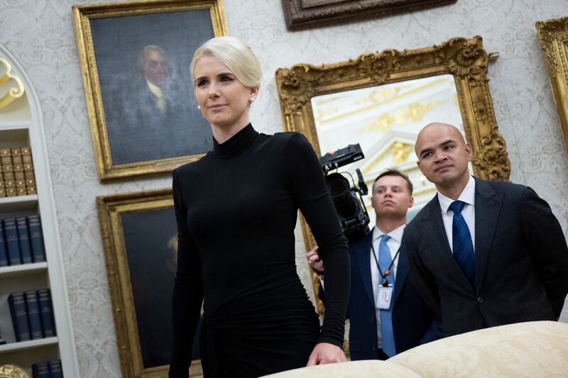 Executive Assistant to the President Natalie Harp, 34, stands in the Oval Office on March 31.