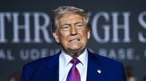 TOPSHOT - US President Donald Trump greets troops at the Al-Udeid air base southwest of Doha on May 15, 2025. (Photo by Brendan SMIALOWSKI / AFP) (Photo by BRENDAN SMIALOWSKI/AFP via Getty Images)