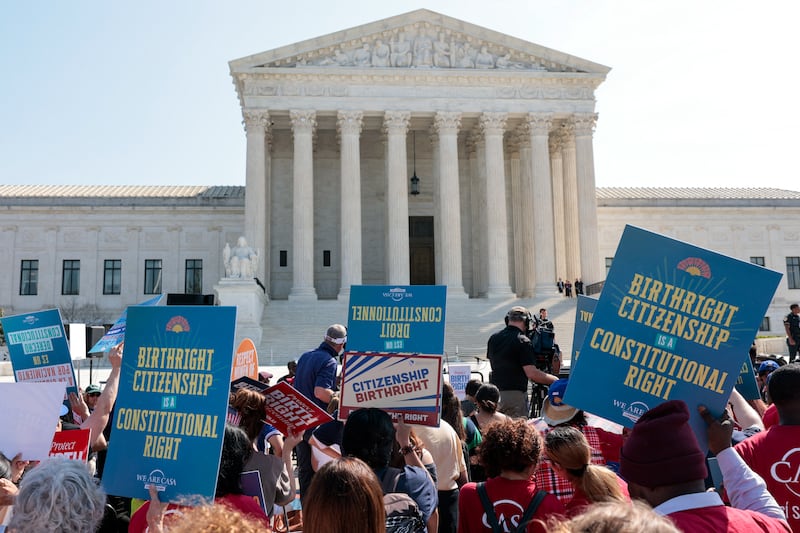 Demonstrators rally in support of birthright citizenship outside the US Supreme Court as President Donald Trump attends oral arguments in Washington, DC on April 1, 2026. President Donald Trump is watching in person as the US Supreme Court hears a landmark case weighing the constitutionality of his contentious bid to end birthright citizenship, an extraordinary and possibly unprecedented move for the nation's highest office.