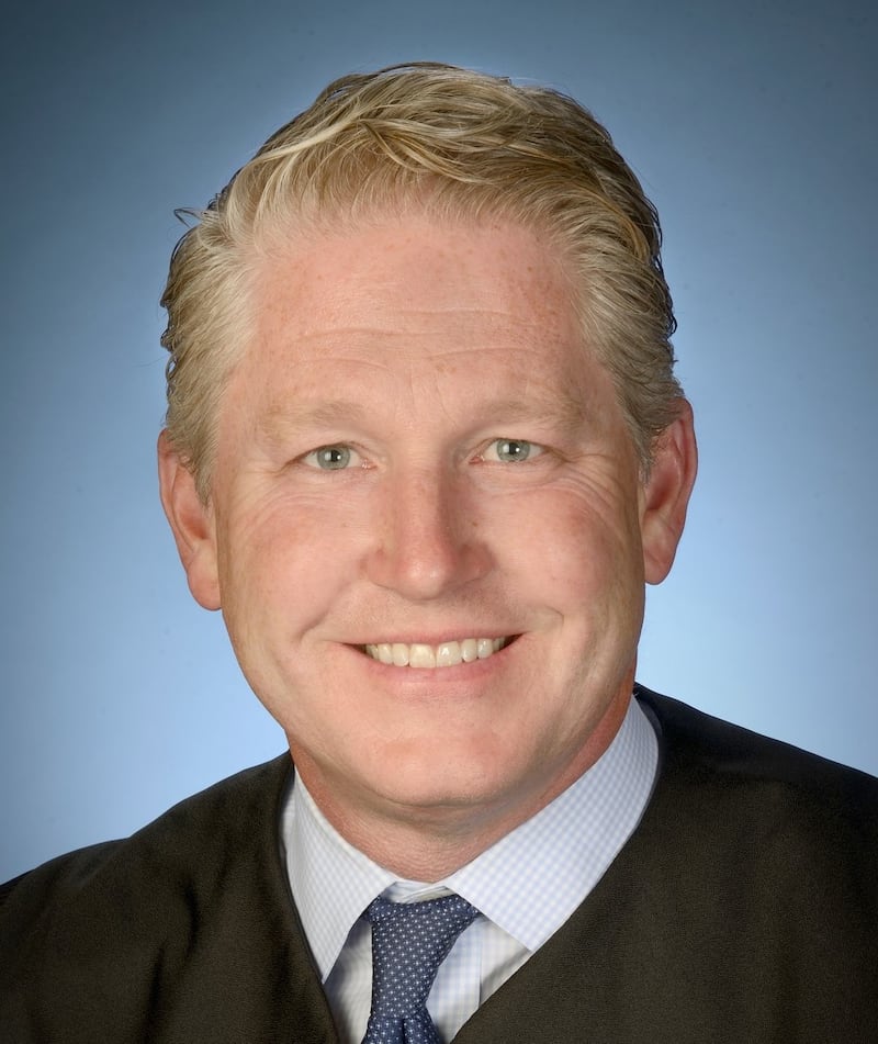 U.S. District Judge Carl Nichols.