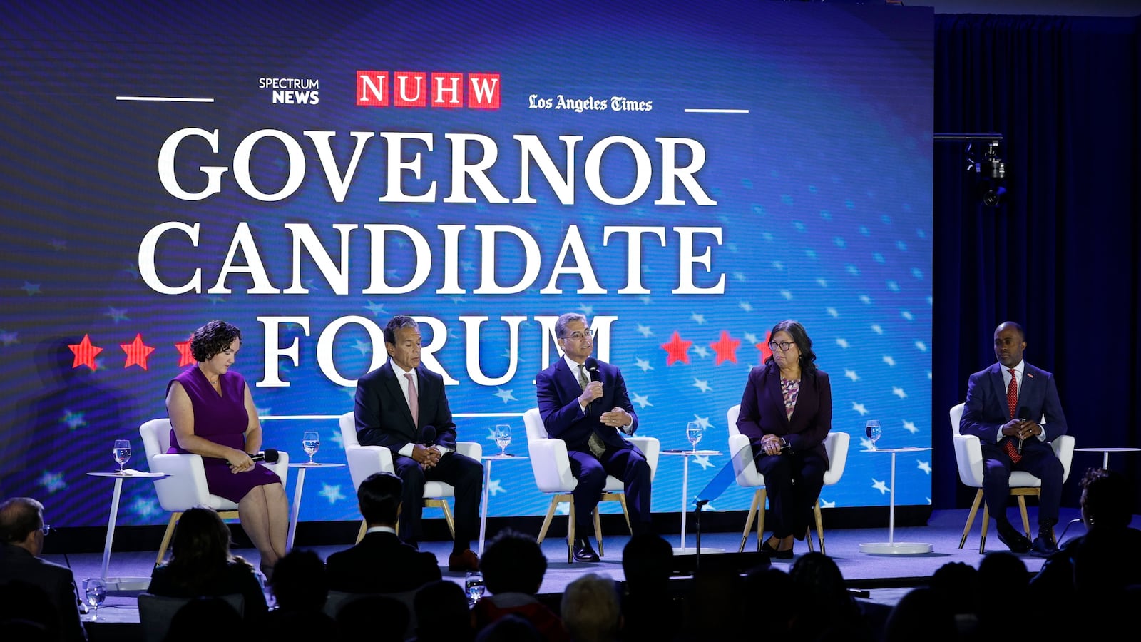 Former Congressmember Katie Porter, former Los Angeles Mayor Antonio Villaraigosa, former United States Health Secretary Xavier Bacerra, former State Controller Betty Yee and California Superintendent of Public Instruction Tony Thurmond sit on stage at the NUHW Governor Candidate Forum at the Hyatt Regency Los Angeles International Airport.