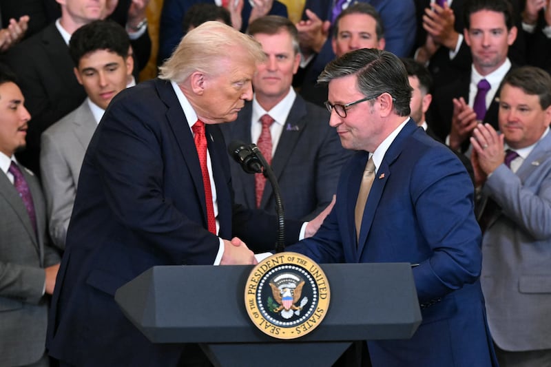 President Donald Trump shakes hands with Speaker of the House Mike Johnson (R) at the White House in Washington, DC, on October 20, 2025.
