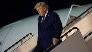 PALM BEACH, FLORIDA - DECEMBER 20: U.S. President Donald Trump walks off Air Force One at Palm Beach International Airport on December 20, 2025 in Palm Beach, Florida. Trump traveled to his Mar-a-Lago club after holding a rally in Rocky Mount, North Carolina. (Photo by Tasos Katopodis/Getty Images)