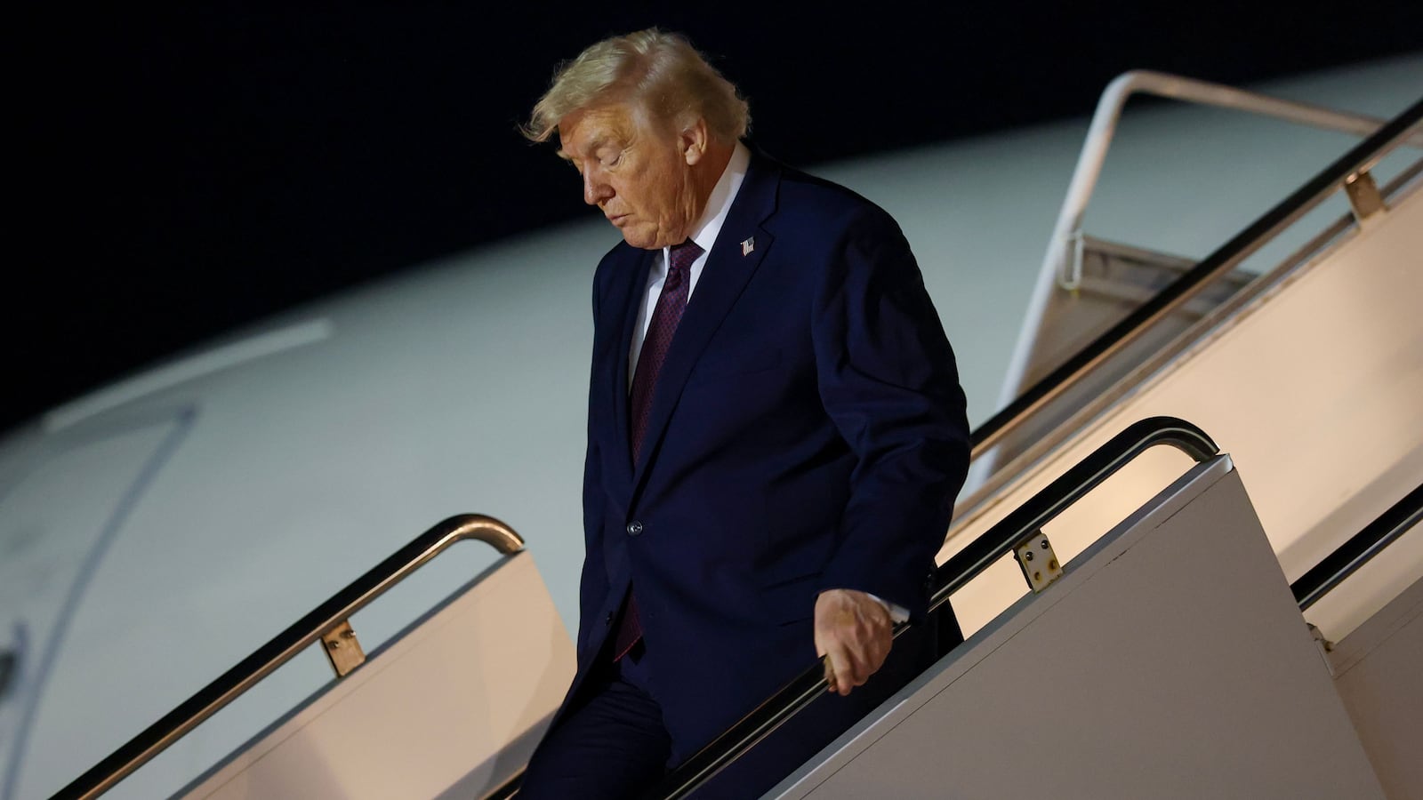 PALM BEACH, FLORIDA - DECEMBER 20: U.S. President Donald Trump walks off Air Force One at Palm Beach International Airport on December 20, 2025 in Palm Beach, Florida. Trump traveled to his Mar-a-Lago club after holding a rally in Rocky Mount, North Carolina. (Photo by Tasos Katopodis/Getty Images)