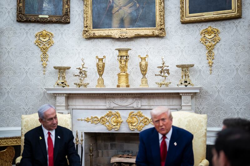 Gold items are seen behind as President Donald J Trump meets with Israel Prime Minister Benjamin Netanyahu in the Oval Office on April 07, 2025 in Washington, DC.