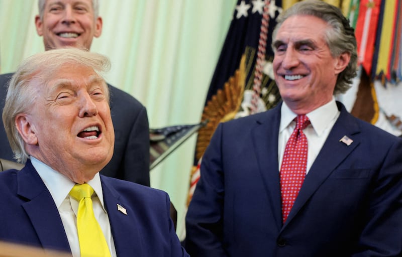 U.S. President Donald Trump reacts as West Virginia Governor Patrick Morrisey, Secretary of Energy Chris Wright and Interior Secretary Doug Burgum stand behind while he delivers remarks about his administration's support for coal energy production, among other topics to reporters in the Oval Office at the White House in Washington, D.C., U.S., June 4, 2026.