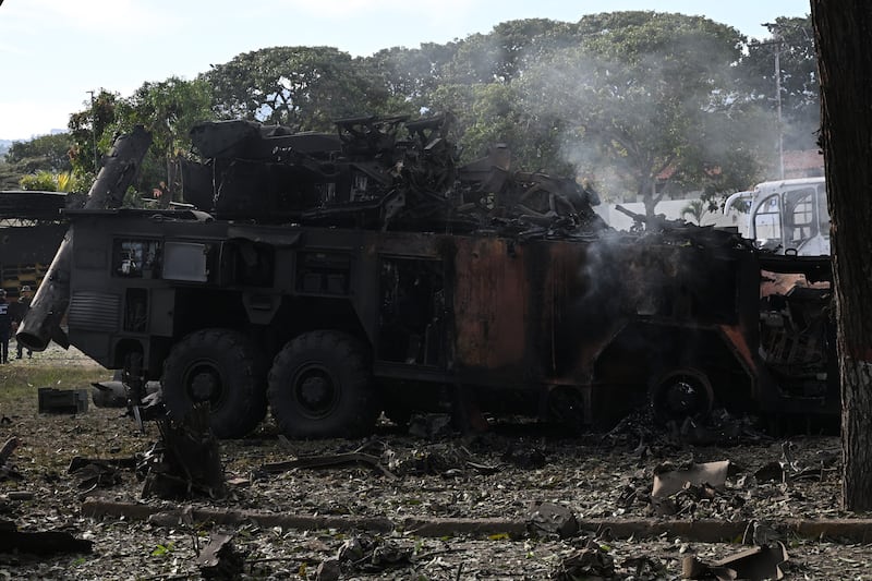 TOPSHOT - A burnt missile interceptor vehicle is seen at La Carlota air base in Caracas on January 3, 2026, after US forces captured Venezuelan leader Nicolas Maduro after launching a "large scale strike" on the South American country. President Donald Trump said on January 3, 2026, that US forces had captured Venezuela's leader Nicolas Maduro after bombing the capital Caracas and other cities in a dramatic climax to a months-long standoff between Trump and his Venezuelan arch-foe. (Photo by Federico PARRA / AFP via Getty Images)
