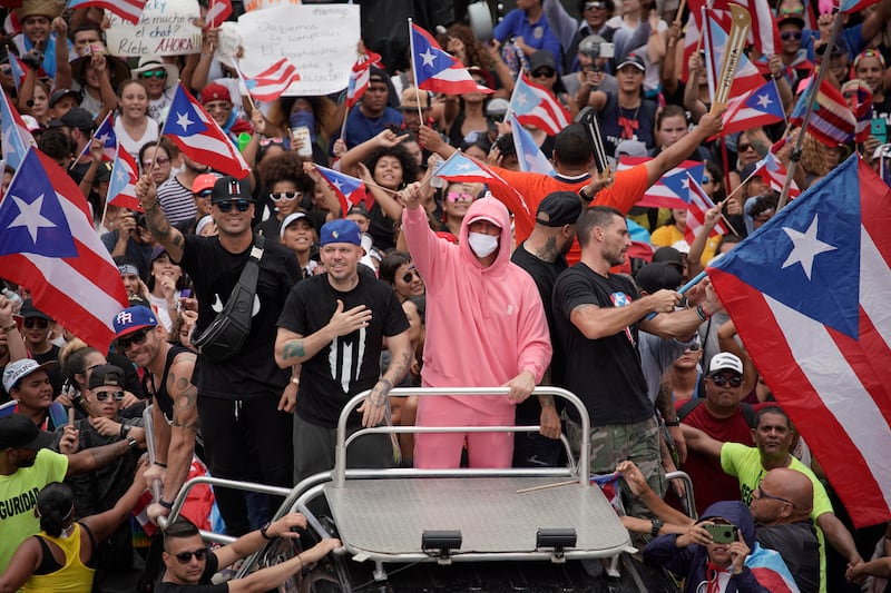 Puerto Rican artists Residente and Bad Bunny join demonstrators in San Juan on July 25, 2019, one day after the resignation of Puerto Rico Governor Ricardo Rossello.