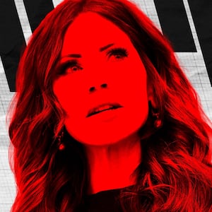 Kristi Noem in front of a poll.