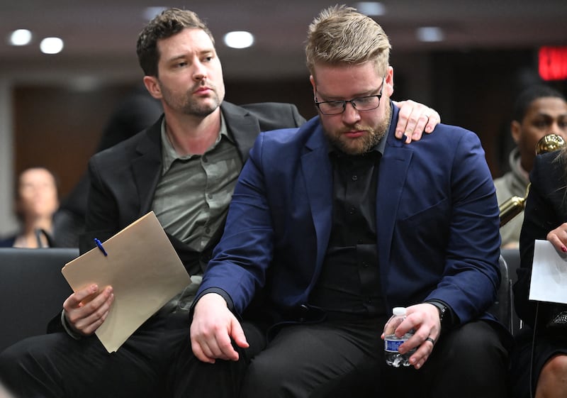 uke Ganger and Brent Ganger, brothers of Renee Good who was killed by a federal immigration agent last month, embrace as they appear at a forum on use of force by Department of Homeland Security agents, on Capitol Hill in Washington, DC, on February 3, 2026. A US judge delivered a blow January 31, 2026 to Minnesota's bid to force Immigration and Customs Enforcement to suspend its sweeping detention and deportation operation in the state that has left two US citizens dead and fueled massive protests. (Photo by ROBERTO SCHMIDT / AFP via Getty Images)