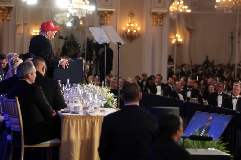 U.S. President Donald Trump wears a 'Trump 2028' hat as he delivers remarks at the WHCA Dinner.