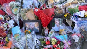 Providence, RI - December 18: Photographs of victims MukhammadAziz Umurzokov and Ella Cook at a memorial set up by Brown University outside of the Barus and Holley building on December 18, 2025.