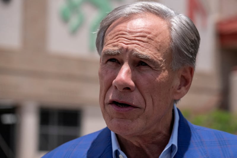 FILE PHOTO: Texas Governor Greg Abbott speaks to reporters after casting his early vote in the state’s primary runoff election at a polling station in Austin, Texas, U.S. May 18, 2026.  REUTERS/Joel Angel Juarez/File Photo