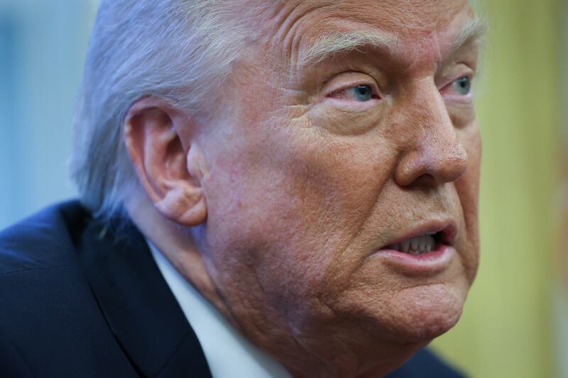 President Donald Trump speaks to the press after signing an executive order in the Oval Office of the White House on March 26, 2025 in Washington, DC.