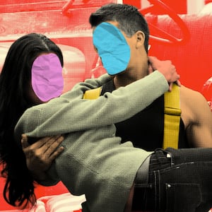 Fireman holding woman