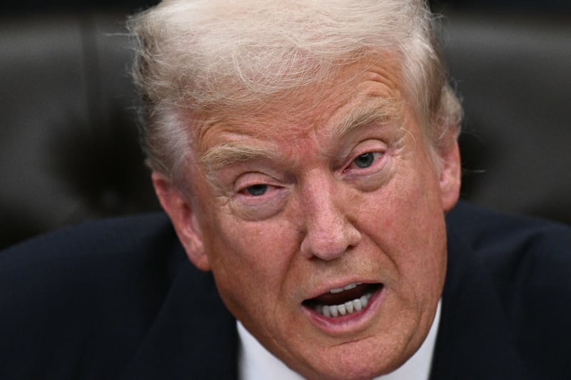 US President Donald Trump speaks while signing the bill package to reopen the federal government in the Oval Office of the White House in Washington, DC, on November 12, 2025. Congress on Wednesday ended the longest government shutdown in US history, 43 days that paralyzed Washington and left hundreds of thousands of workers unpaid while Republicans and Democrats played a high-stakes blame game. The Republican-led House of Representatives voted largely along party lines to approve a Senate-passed package that will reopen federal departments and agencies, as many Democrats fume over what they see as a capitulation by party leaders. (Photo by Brendan SMIALOWSKI / AFP) (Photo by BRENDAN SMIALOWSKI/AFP via Getty Images)