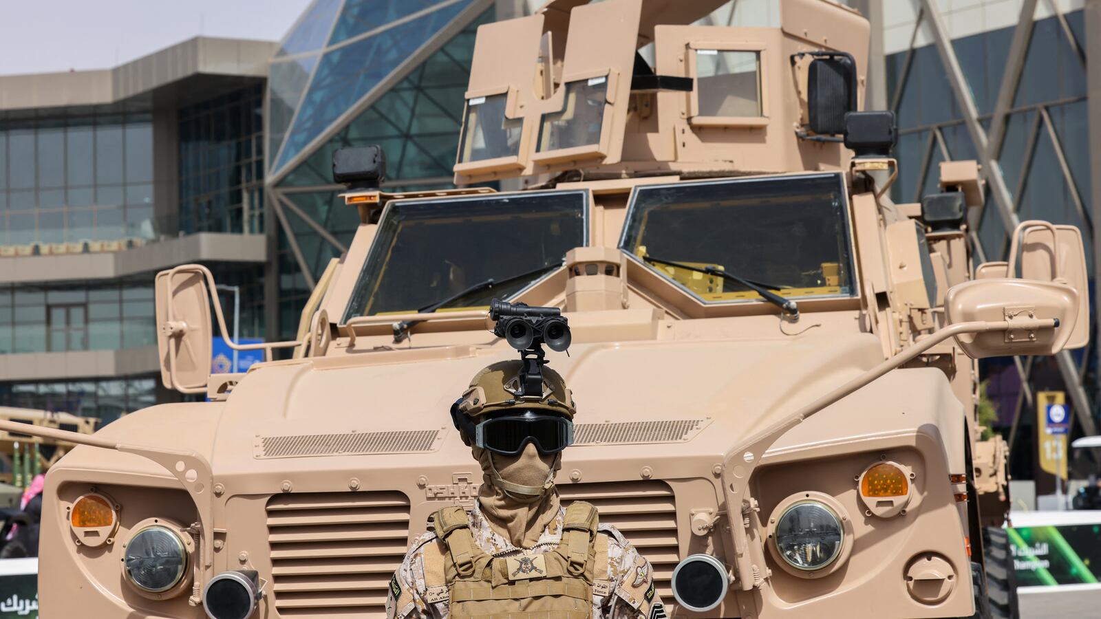A Saudi member of special armed forces stands in front of a military vehicle during the World Defense Show 2024, north of the Saudi capital Riyadh on Feb. 4, 2024.