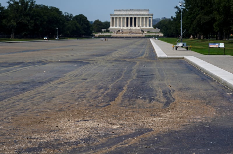Debris covers the surface of the drained Lincoln Memorial Reflecting Pool, following renovations and Independence Day celebrations, in Washington, D.C., U.S., July 15, 2026.
