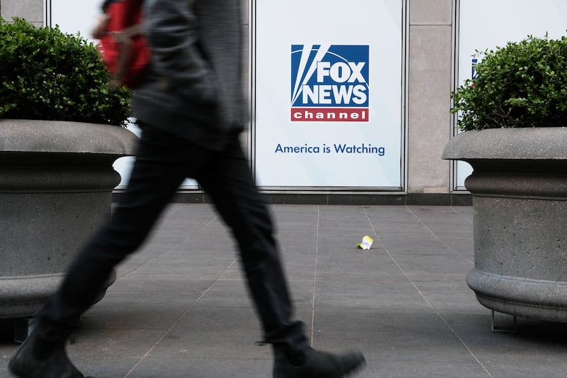 NEW YORK CITY - APRIL 18: People walk by the News Corporation headquarters, home to Fox News, on April 18, 2023 in New York City. Moments before opening arguments were set to begin this afternoon, Fox News and Dominion Voting Systems said that they had reached a settlement of $787 million in the voting machine company’s defamation lawsuit against Fox. (Photo by Spencer Platt/Getty Images)