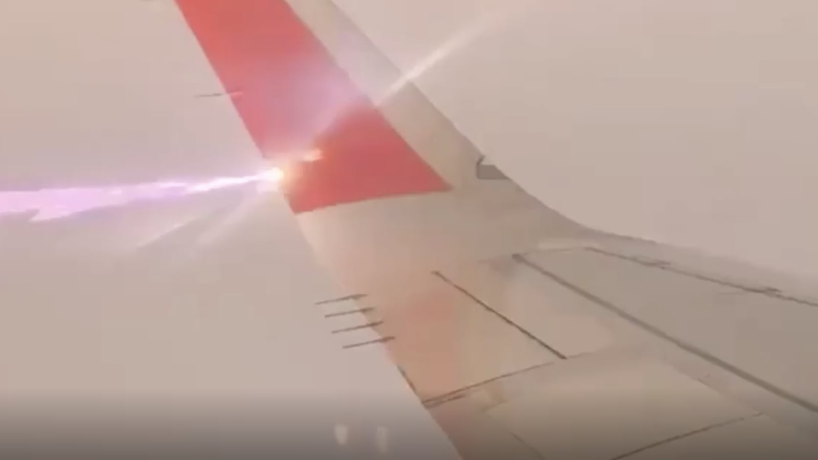 Lightning bolt hitting a plane wing.