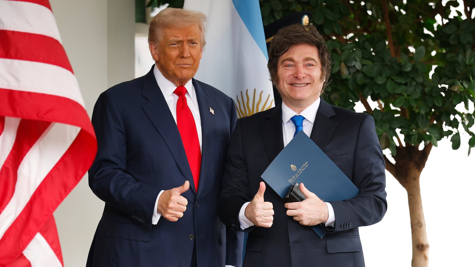 WASHINGTON, DC - OCTOBER 14: U.S. President Donald Trump (L) greets President of Argentina Javier Milei as he arrives at the West Wing of the White House on October 14, 2025 in Washington, DC. Trump is hosting Milei for a working lunch days after the U.S. Treasury finalized a $20 billion currency swap framework with Argentina in an effort to help stabilize its economy. (Photo by Kevin Dietsch/Getty Images)