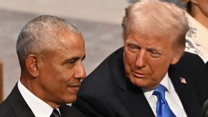Donald Trump speaks with former President Barack Obama as they attend the State Funeral Service for former US President Jimmy Carter at the Washington National Cathedral in Washington, DC,