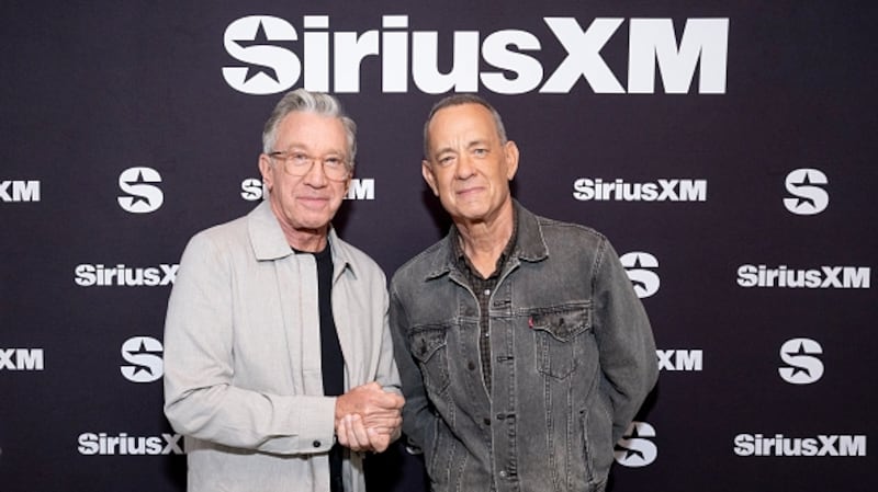 Tim Allen (left) alongside actor Tom Hanks, who played Woody in the Toy Story film series.