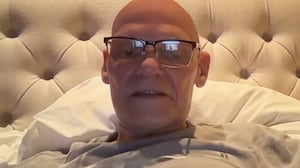 James Carville records his podcast from bed.