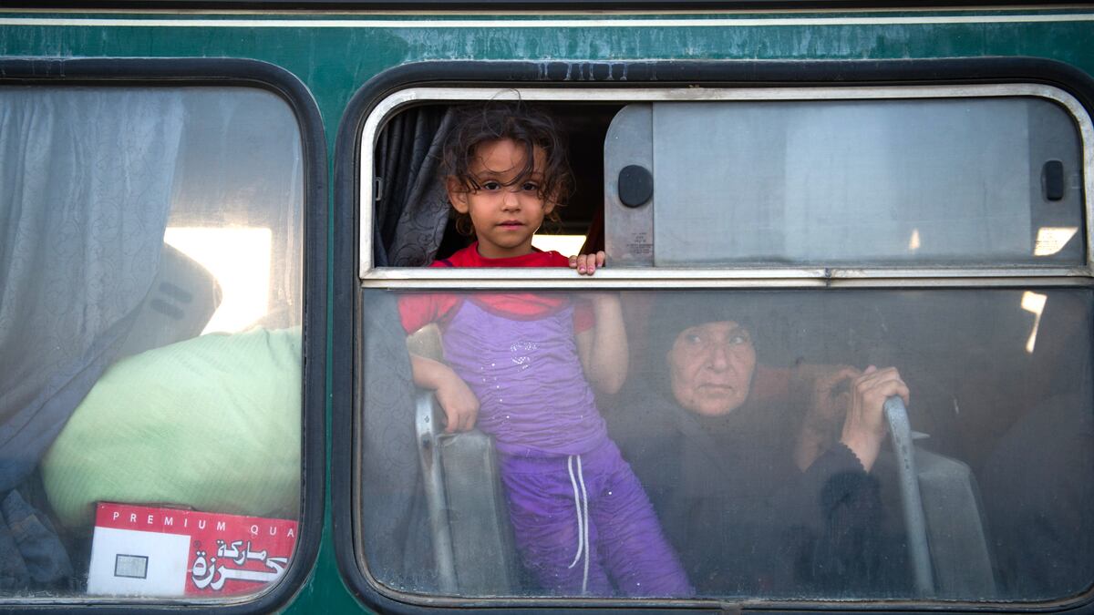 articles/2012/08/17/a-waiting-game-for-rebels-and-residents-in-syrian-border-towns/syria-border-crossing-banco_sh3y2c