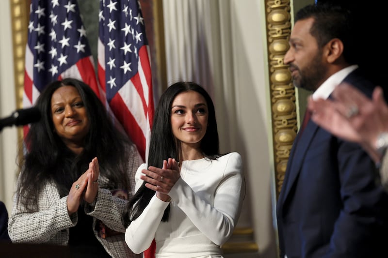 Kash Patel is applauded by his partner Alekins Wilkins after being sworn in as FBI director by U.S. Attorney General Pam Bondi in the Indian Treaty Room in the Eisenhower Executive Office Building (EEOB) on the White House campus in Washington, D.C., U.S., February 21, 2025. REUTERS/Leah Millis