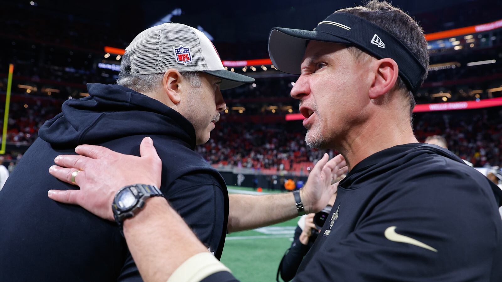 Head coach Arthur Smith (L) of the Atlanta Falcons greets head coach Dennis Allen (R) of the New Orleans Saints