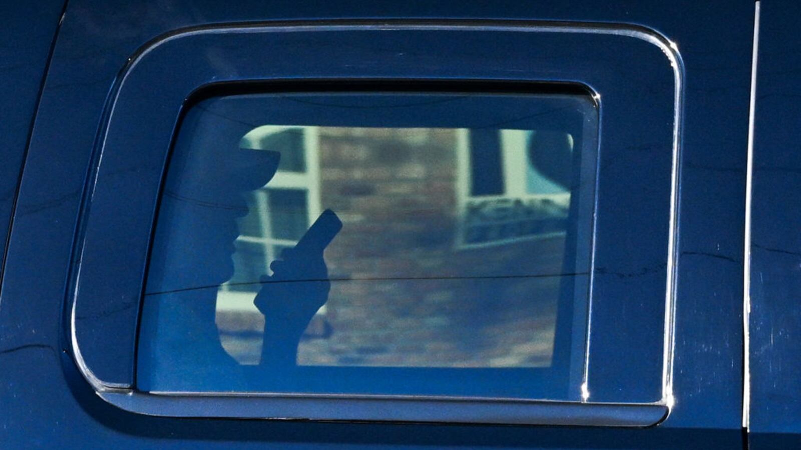 US President-elect Donald Trump talks on phone as he rides back from Trump International Golf Club to Mar-a-Lago, his residence in West Palm Beach, Florida, on November 27, 2024.