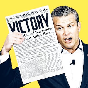 Pete Hegseth holding a World War 2 newspaper.
