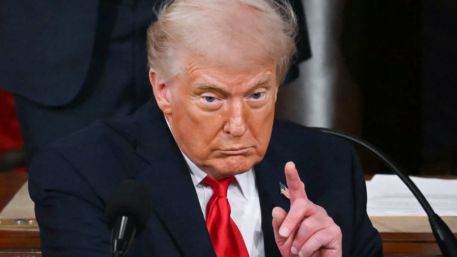 President Donald Trump gestures as he delivers the State of the Union address.