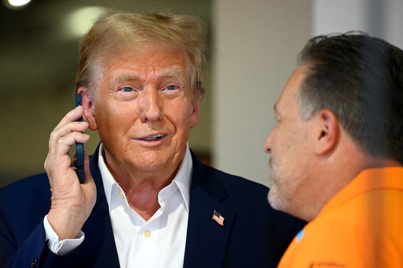 Donald Trump talks on the phone.