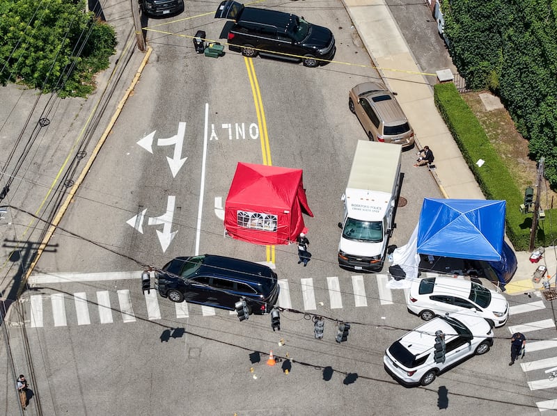 A drone view shows members of law enforcement working at the scene of a shooting involving U.S. Immigration and Customs Enforcement (ICE) in Biddeford, Maine