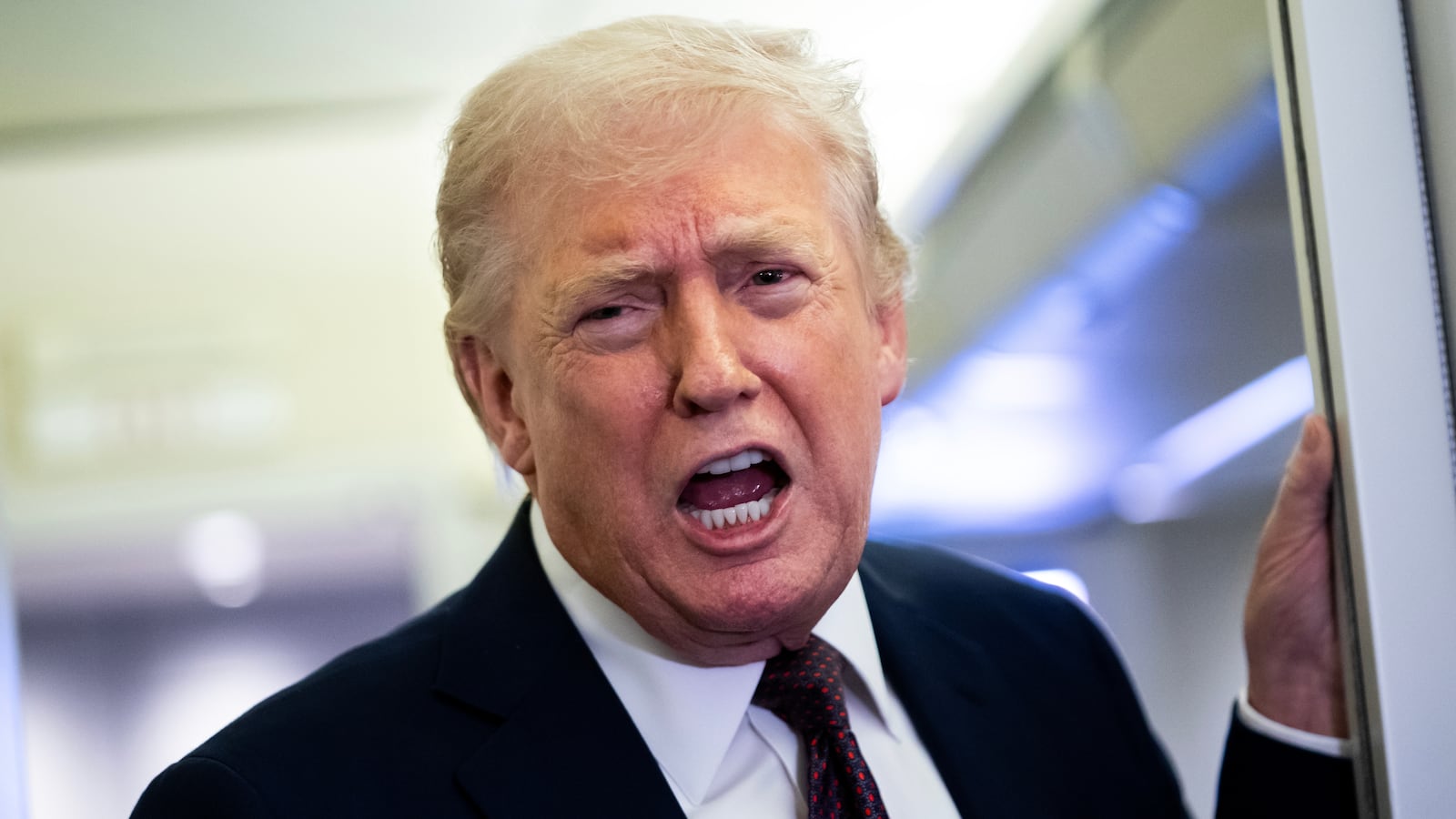 IN FLIGHT - MARCH 15: U.S. President Donald Trump speaks to members of the media onboard Air Force One on March 15, 2026 while en route to Joint Base Andrews, Maryland from West Palm Beach Florida. President Trump returned to Washington D.C. on Sunday following a weekend trip to Florida. (Photo by Nathan Howard/Getty Images)