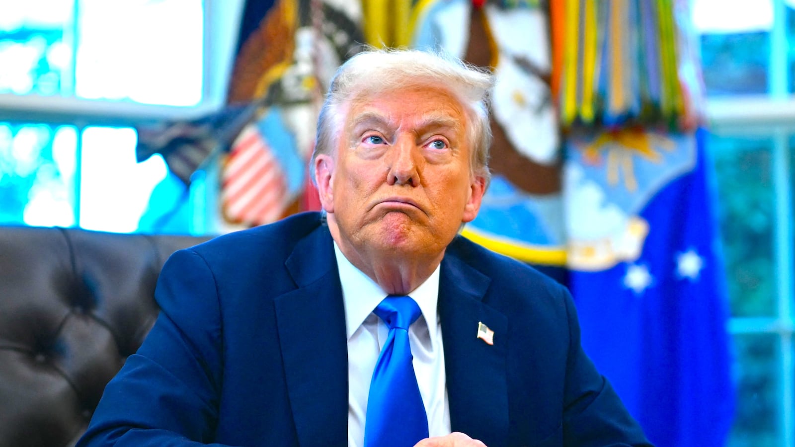 President Donald Trump speaks before signing executive orders in the Oval Office at the White House in Washington, DC, on September 19, 2025.