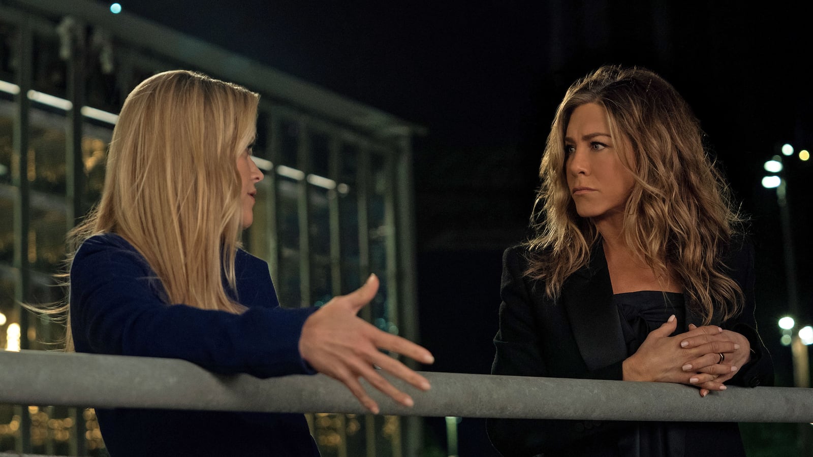 Reese Witherspoon and Jennifer Aniston in "The Morning Show" stand next to each other