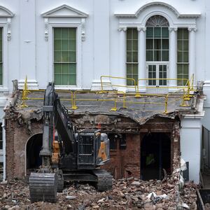 WASHINGTON, DC - OCTOBER 28: An excavator sits on the rubble after the East Wing of the White House was demolished on October 28, 2025 in Washington, DC. The demolition is part of U.S. President Donald Trump's plan to build a ballroom on the eastern side of the White House. (Photo by Alex Wong/Getty Images)