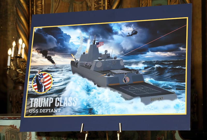 PALM BEACH, FLORIDA - DECEMBER 22: An artist rendering of the newly announced “Trump-class” battleship is displayed as President Donald Trump announces the new Naval ship class during a statement to the media at his Mar-a-Lago estate on December 22, 2025 in Palm Beach, Florida. Trump announced the new class of ship will become the centerpiece of his “Golden Fleet” program to rebuild and strengthen the U.S. shipbuilding industry. (Photo by Tasos Katopodis/Getty Images)