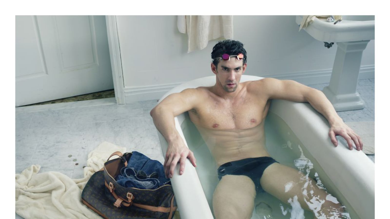 articles/2012/08/13/michael-phelps-new-louis-vuitton-ad-let-the-jennifer-aniston-wedding-dress-guessing-game-begin/michael-phelps-vuitton-ad_vd3aix